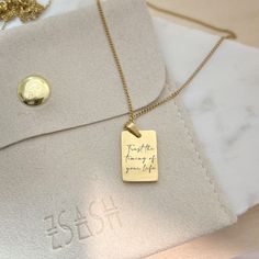 Our simple yet meaningful pendant necklace is the perfect reminder that sometimes we just need to "Trust the timing of your life" especially when things don't got according to our plan.. Chain Length: 45cm Pendant Size: 1.5cm (H) x 1cm (W) Our chain comes with an adjustable 5cm extender for easy layering. Both our chain and pendants are made with high quality Stainless steel with PVD 18k Gold plating, meaning they are sweat, swim, and shower resistant and suitable for everyday wear. Stainless Steel Pendant Necklace With Engraving Option, Minimalist Personalized Necklace For Everyday Use, Meaningful Engraved Necklace For Everyday, Everyday Meaningful Engraved Charm Necklaces, Everyday Engraved Meaningful Charm Necklaces, Inspirational Pendant Charm Necklaces For Everyday, Meaningful Everyday Pendant Necklace, Gold Engraved Stainless Steel Chain Necklace, Everyday Rectangular Necklaces With Engraved Text