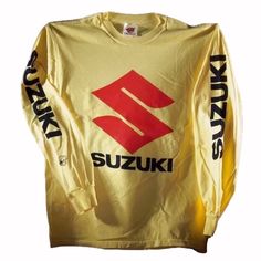 a yellow shirt with the suzuki logo on it