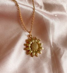 "Our favorite, this cute Sunflower charm Necklace in gold! 🌻 Hand made by Holly from Tumbled Shop with a gold tone pendant of a yellow sunflower and hung on a 14K gold plated chain 18\" long.  We are honored you are here! Thank you for supporting our small business and unique healing creations. Orders over $50 get free shipping in the US & a Free TumbledShop sticker! 🔮To stay updated with new items follow us on Instagram @Tumbledshop OR Click the link below! 🌻 https://www.instagram.com/tumbledshop/ ** Remember to FAVORITE the Tumbled Shop as I add inventory daily! (Click the heart next to our shop name). ❤️" Yellow Gold Charm Necklaces With Flower Charm, Yellow Gold Flower Charm Pendant Necklace, Yellow Gold Pendant Charm Necklace With Flower, 14k Yellow Gold Filled Jewelry With Flower Charm, Yellow Gold Flower Charm Necklaces, Yellow Gold Flower Necklaces With Charms, Yellow Gold Flower-shaped Necklaces With Charms, Everyday Gold Plated Jewelry With Flower Charm, Yellow Gold Flower-shaped Necklace With Charms