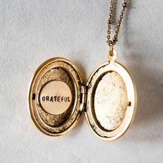 Personalize our popular Locket Necklaces with hand stamping on the inside! Lockets on 18" gold or silver plated satellite chain. Add on a small accent/birthstone for an additional $5 here: https://bit.ly/BVJBirthstoneAddOn Please tell us what you would like stamped on the charms in the "Notes" section at check out. Handcrafted in Little Rock, Arkansas Our images are the best representation of our designs and there may be some variation in your shipment due to the handmade nature of our products. Gold Medallion Locket Necklace Stamped 14k, Vintage Gold Locket Necklace Stamped 14k, Adjustable Brass Locket Necklace Gift, Antique 14k Stamped Locket Necklace Collectible, Engraved Silver-colored Brass Locket Necklace, Locket Necklaces, Little Rock Arkansas, Round Necklace, Hand Stamped Jewelry