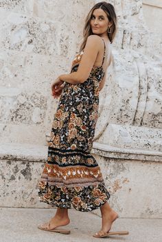 Black Retro Boho Floral Tassel Tie Maxi Dress Black Bohemian Dress With Boho Print, Black Bohemian Sundress For Vacation, Black Boho Print Dress For Festival, Black Flowy Boho Dress With Boho Print, Black Boho Print Maxi Length Dress, Black Boho Print Maxi Dress For Vacation, Casual Black Dress With Tassels, Black Bohemian Midi Dress For Vacation, Festival Black Maxi Dress With Floral Print