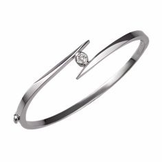 Our solitaire bangle bracelet is set with a fine-quality diamond that weighs 0.25ct. The hinged bracelet weighs 13 grams and is available in 14k white, yellow, and rose gold. Classic White Gold Bangle With Single Diamond, Classic White Gold Cuff Bracelet With Single Cut Diamonds, Classic White Gold Diamond Cuff Bracelet, Elegant Single Diamond Bangle Bracelet, Timeless Single Diamond Bangle Bracelet, Formal Bangle With Single Diamond, Formal Diamond Bangle With Single Diamond, Modern White Gold Bangle With Single Cut Diamonds, Timeless Formal Bangle With Single Diamond