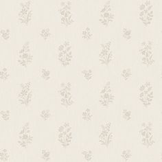 a white wallpaper with small flowers on it