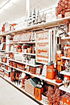 a store filled with lots of orange and white items next to shelves full of decorations