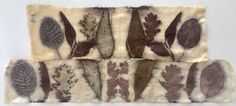 four pieces of cloth with leaves on them, one is brown and the other is white