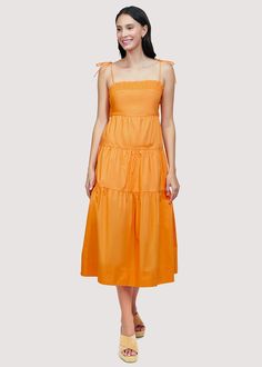 Get ready to turn heads in our Paradiso Midi Dress! Made from soft cotton poplin in a beautiful apricot shade, this dress is a true sun dress silhouette. Its relaxed fit and easy midi length make it the perfect choice for sunny days. Complete your look with sandals and a sun hat. WDWH23282 Imported Lined Self: 100% CottonLining: 100% Rayon Model is 5 ft 9.5 inches; Bust: 32", Waist: 24", Hips: 34" and wearing a size Small Runs true to size Hand wash or wash with gentle cycle with cold water with like colors, Air dry to avoid shrinkage Solid Cotton Sundress For Spring, Solid Cotton Midi Dress For Beach, Cotton Midi Dress For Summer, Cotton Maxi Sundress For Daytime, Chic Solid Cotton Midi Dress, Solid Spring Midi Sundress, Solid Summer Cotton Maxi Dress, Solid Color Midi Length Sundress For Spring, Solid Midi Sundress For Brunch