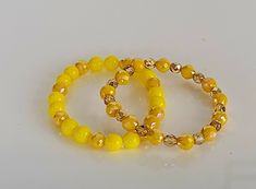 Beaded bracelet set bright yellow and yellow gold beads bracelets. Size 7 Playful Adjustable Yellow Beaded Bracelets, Playful Yellow Beaded Stretch Bracelet, Adjustable Yellow Hand-strung Beaded Bracelets, Handmade Yellow Multi-strand Beads, Yellow Multi-strand Polished Beads Jewelry, Beads Bracelets, Gold Bead Bracelets, Bright Yellow, Gold Beads