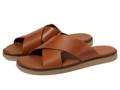 Cole Haan Nantucket Cross Strap Sandals - Men's Sandals : British Tan/Dark Latte : Slip into style and comfort by wearing the Cole Haan Nantucket Cross Strap Sandals. The slip-on style sandals have an open round-toe design, detailing as a beefroll penny keeps with a beautifully stitched moc toe and heel, stitched midsole and leather choices offered all deliver a comfortable wearing experience. The leather upper and lining with EVA insole construction make this pair a perfect pick for everyday wear. Rubber outsole. Imported. Measurements: Weight: 9 oz Product measurements were taken using size 9, width D - Medium. Please note that measurements may vary by size. Classic Slip-on Sandals For Vacation, Classic Slip-on Summer Slippers, Casual Slip-on Sandals With Leather Lining, Classic Leather Slides For Vacation, Classic Summer Slip-on Slippers, Casual Leather Lined Slip-on Sandals, Casual Leather-lined Slip-on Sandals, Classic Slip-on Sandals With Leather Lining, Classic Cushioned Slip-on Sandals