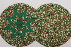 two green and red christmas coasters with holly designs on them, one is folded in the shape of a snowflake