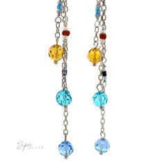 Blue and yellow multi-beaded dangle earrings Materials: .925 Sterling Silver, Multicolored Beads Dimensions: 93mm length Multicolor Long Drop Beaded Jewelry, Colorful Beaded Earrings In Sterling Silver, Silver Chandelier Earrings With Colorful Beads As Gift, Sterling Silver Beaded Earrings With Colorful Beads, Silver Sterling Beaded Earrings With Colorful Beads, Sterling Silver Jewelry With Colorful Beads, Multicolor Beaded Drop Earrings With Beaded Chain, Colorful Czech Glass Dangle Beads Jewelry, Czech Glass Beaded Dangle Jewelry