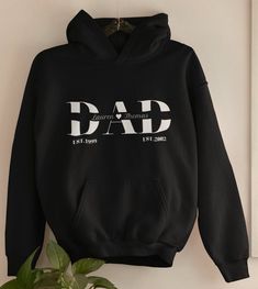 Surprise your dad with this custom made hoodie made just for him. Our hoodies are super soft and comfortable perfect for the colder days. ☞HOW TO ORDER: 1️⃣Select the shirt size & color. 2️⃣Add your text/personalization request (if the item is customizable and has a personalization box) 3️⃣Click add to cart. 4️⃣Do the same process, if you want 2 or more of the same product. 5️⃣Proceed to payments & now you just relax and wait for your order 🔍 PRODUCT DETAIL - 50% cotton 50% polyester, which mak Dad Sweaters, Mom And Dad Sweatshirts, Fathers Day Hoodie Ideas, Customizable Long Sleeve Sweatshirt For Father's Day, Father’s Day Name Print Crew Neck Shirt, Mom Hoodies, Just Relax, Custom Orders, Cold Day