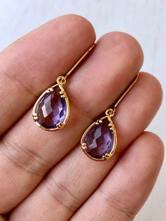 Amethyst Earrings, February Birthstone, Purple Teardrop Gem Earrings in Gold or Silver, Purple Jewelry, Lavender Earrings, Gift for women These small but gorgeous earrings feature deep purple amethyst teardrops bezel framed in either 14k gold filled or sterling silver. The teardrops are suspended form lever back ear wires in the finish of your choice. These are small, delicate and dainty earrings but with a gorgeous lavender color sure to match many outfits. Ideal for a girl or a women that like Formal Teardrop Amethyst Earrings, Elegant Purple Gemstone Teardrop Earrings, Everyday Purple Gemstone Earrings, Purple Gemstone Teardrop Earrings, Elegant Purple 14k Gold Earrings, Lavender Earrings, Amethyst Birthstone, Purple Gems, Silver Gift Wrap