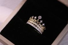 "14k Gold Princess Tiara Crown Ring / Yellow Gold CZ Princess Crown Ring FEATURES @ Made to Order @ Materials: 14K @ Avg Weight: 3.4g @ Gemstone: Cubic @ Setting Type: Prong @ Handmade in the USA SIZING If you need assistance with your ring size, just hit the \"Message CherVenue\" button and we will get back you within a few hours. RETURNS & EXCHANGES I gladly accept returns, exchanges, and cancellations Contact me within: 7 days of delivery Ship items back within: 14 days of delivery Request a Gold Ring Design For Women Crown, Queen Ring Design Gold, Queen Rings Princess Crowns, Queen Ring Design, Wedding Rings Crown, Crown Ring Queen, Crown Ring Design, Princess Ring Crown, Crown Gold Ring