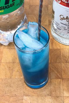 a blue drink sitting on top of a wooden table