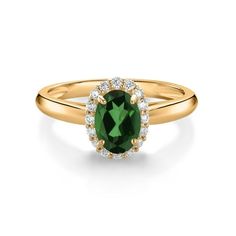 a gold ring with an oval green stone surrounded by small white diamond halos on the band