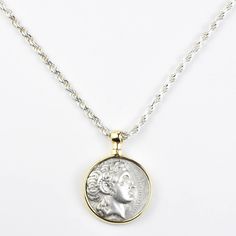 Ancient Alexander the Great Coin Necklace - Goldmakers Fine Jewelry Mythological Silver Jewelry With Coin Pendant, Silver Mythological Jewelry With Coin Pendant, White Gold Necklace With Coin Pendant, Ancient Style Round Silver Necklace, Ancient Style Silver Round Necklaces, Byzantine Silver Coin Necklace, Silver Byzantine Coin Necklace, Luxury Silver Coin Necklace With Coin Pendant, Luxury Silver Coin Necklace With Pendant