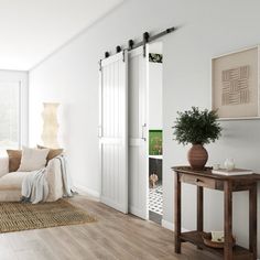 a living room with white walls and wood flooring on the wooden floor, two doors open to let in natural light