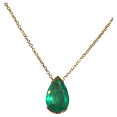 Natural Fine Colombian Emerald Pear Drop Pendant, crafted in an 18 Karat Gold bezel setting – designed to show the spectacular brilliance and beautiful medium green color and excellent transparency of this magnificent gemstone. - Natural Colombian Emerald 3.00 Carats. - Set in 18 Karat Gold. - Length 15.00mm Width 8.00 mm Depth 5.79 mm. - Suspended on 18 Karat Gold chain, 18 inches in length. Luxury Pear-shaped Emerald Gemstone Necklace, Pear-shaped Emerald Gemstone Necklace For Formal Events, Pear-shaped Emerald Gemstone Necklace For Formal Occasions, Exquisite Pear-shaped Emerald Necklace For Formal Occasions, Elegant Pear-shaped Emerald Necklace For Formal Occasions, Elegant Formal Pear-shaped Emerald Necklace, Formal Pear-shaped Emerald Necklace In Fine Jewelry Style, Formal Pear-shaped Emerald Necklace Fine Jewelry, Formal Pear-shaped Emerald Necklace