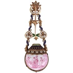 Chatelaine in gold and enamel. The chatelaine is ornamented with three painted medallions in monochrome pink and features cupids. These medallions are linked by S-shaped motifs in red and green enamel. The largest medallion is decorated with a mythological scene featuring Venus surrounded by nymphs as she strings Cupid’s bow. The scene on the reverse side is decorated with Cupid’s chariot that is being pulled by nymphs. The medallion opens as a locket, with room to insert a small watch or a perf Small Watch, Chatelaine, Green Enamel, Purple Wallpaper, Gold Enamel, Stone Necklace, Locket, Two By Two, Purple