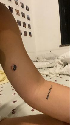 a person with a small tattoo on their arm