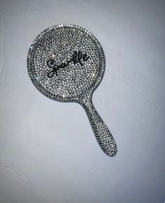 a tennis racquet with the word love written on it's back side