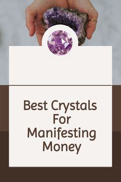 a person holding a rock with the words best crystals for manifesting money on it