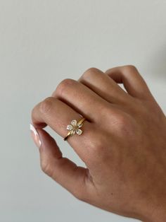 Flower ring - This adjustable dainty flower ring is incredibly stunning. Made to sparkle and shine on any finger! A perfect gift for women, girlfriend, best friends, sisters, moms. A perfect option for those who like minimal dainty gold rings and want to have the perfect size. - gold filled - stainless steel and gold - cz stones - minimalist - adjustable WHY VASI Jewelry? - Ethically sourced gems and stones - Made with recycled gold - Handmade or designed/sourced - Shop local (based in Chicago) Delicate Flower Ring As A Gift, Delicate Flower Ring As Gift, Delicate Flower Shaped Ring For Gift, Delicate Flower Ring For Spring Gift, Flower Shaped Promise Ring, Delicate Spring Flower Ring Gift, Dainty Jewelry For Anniversary In Spring, Dainty Jewelry For Spring Anniversary, Flower Shaped Cubic Zirconia Gift Ring