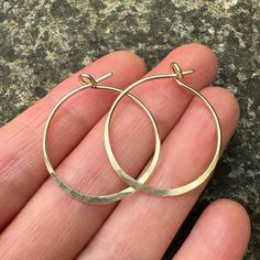 These Hammered Gold Hoop Earrings are handmade in my little studio. They feature a subtle hammered edge and shiny finish. The 14k Gold Filled Hoops are 1mm thick, and sit comfortably in the ear. Each pair is around 26mm wide. Your earrings will be delivered in a recycled, branded jewellery box ready for gifting. Delivery These hammered earrings are ready to be shipped.  See other earrings in my shop here https://www.etsy.com/uk/shop/MineralsRockStudio -What is gold filled?- Gold filled is a proc Branded Jewellery, Handmade Hoop Earrings, Hammered Earrings, Gold Filled Hoops, Hammered Gold, Handmade Gold, Gold Hoops, Gold Filled Jewelry, Jewelry Earrings Hoops