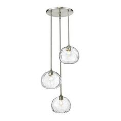 three lights hanging from a ceiling fixture with clear glass globes on the top and bottom