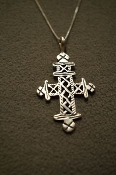 I am offering you this spectacular genuine sterling silver necklace and pendant charm. This piece is completely unique with the following features:. Sterling silver fancy etched and scrolled cross pendant charm. It hangs on a 20 inch box link chain necklace. What Stunning detailing we have here. The Pendant measures app. 2 by app. 1 inches. It weighs app. 12 grams ! This is in a classic, yet very distinct bold necklace. There is tons of sparkle and shine with this piece. Buyer pays all shipping Sterling Silver Cross Necklace, Sterling Silver Wedding Band, Bold Necklace, Religious Cross, Art Deco Pendant, Silver Cross Pendant, Silver Wedding Bands, Link Chain Necklace, Sterling Silver Cross