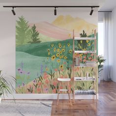 a wall mural with flowers and mountains in the background