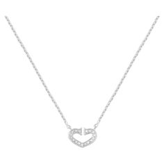 Cartier 18k white gold Coeur C de diamond Heart necklace. This necklace is from the Heart and Symbols Cartier collection. A precious diamond heart pendant with approximately 0.09ctw diamonds sits at the center of this 18k white gold necklace. Diamonds are F-G in color and VS in clarity. Chain length: 16 inches. Excellent pre-owned condition. Comes with a Cartier box. Papers are not included. Cartier Pendant, Heart Shaped Diamond Necklace, Cartier Diamond, Diamond Heart Necklace, Heart Shaped Pendant Necklace, Heart Shaped Pendant, White Gold Necklace, Heart Necklace Diamond, Heart Shaped Necklace