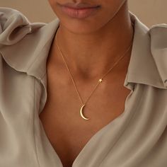 The Crescent Moon Necklace is captivating, featuring a delicate gold half-moon paired with a shining star charm.  Crafted with a high-quality 925 Sterling Silver base, expertly plated with 14k Gold for an exquisite finish, this dainty necklace is perfect for everyday elegance or as a thoughtful gift for her.  Its minimalist yet enchanting design makes it a timeless statement piece, embodying the beauty of the moon and stars in a refined, wearable form. M O O N ∙ S T A R ∙ N E C K L A C E ✧ Dimen Minimalist Gold Necklaces With Moon Charm, Minimalist Yellow Gold Moon Necklace, Dainty Brass Moon Charm Necklace, Minimalist Gold-plated Necklace With Moon Charm, Dainty 14k Gold-filled Necklace With Moon Charm, Moon Necklace Gold, Luna Necklace, Crescent Moon Necklace Gold, Star Necklace Gold