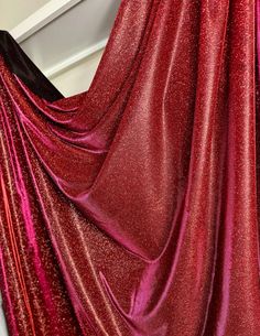 Elevate your designs with our Red Lurex Glitter Fabric--perfect for gowns, backdrops, and drapes. This luxurious material exudes glamour and sophistication, infusing your creations with a timeless charm. Plus, enjoy the convenience of receiving multiple yards in one continuous piece for uninterrupted, stunning designs. Ideal for bespoke gowns and breathtaking event backdrops. Make a statement with our red sparkle fabric!  We guarantee premium quality Event Backdrops, Sparkle Fabric, Dress Event, Lurex Fabric, Event Backdrop, Red Sparkle, Gowns Wedding, Glitter Fabric, Material Girls