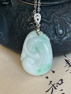 Elegant Jadeite Ruyi Pendant with S925 Clasp & Chain Ruyi is a symbol and words for everything goes as you wish. It's a good luck symbol!  These are very high quality, smooth with vitreous surface! One is light lavender color and another is milky color mixed with splash of green in it.   Immerse yourself in the allure of this meticulously carved Jadeite Ruyi pendant. With its smooth contours and traditional symbolism, the Ruyi represents good fortune, power, and authority in Chinese culture. Thi Jade Jewelry With Large Pendant As A Gift, Jade Jewelry With Large Pendant For Gift, Jade Pendant Necklace For Anniversary, Anniversary Jade Pendant Necklace, Elegant Engraved Jade Necklace, Spiritual Jade Jewelry For Good Luck, White Gold Jade Pendant Jewelry, Spiritual Jade Jewelry With Large Pendant, Fine Jewelry Jade Pendant Necklace