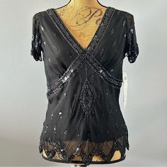 Nwt Adriannna Papell Boutique Beaded Sequin Top Black And Silver. Great With Long Skirt Or Palazzo Pants. Evening, Formal, Sleeveless And Form Fitting. Take It On Your Next Cruise! Pick Up This Beautiful Black Sequin And Beaded Evening Blouse For Your Next Holiday Party, Formal Event Or Maybe Just A Fancy Dinner. With Intricate Sequin And Beading You’re Sure To Shine! Pretty Flowing Cap Sleeve And Sequin Decoration Around The Breast Of Blouse. 100% Silk Shell With 100% Polyester Lining. Perfect Elegant Beaded Tops For Night Out, Elegant Fitted Beaded Blouse, Black Beaded Top For Night Out, Formal Beaded Tops For Summer, Elegant Beaded Black Tops, Elegant Black Beaded Top, Fitted Black Beaded Blouse, Glamorous Black Beaded Tops, Black Beaded Blouse For Party