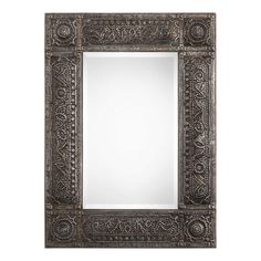 an ornate mirror is shown against a white background