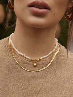 Our Gabby Necklace can easily amplify your casual look. This everyday double-stranded gold necklace is simple yet unique in stylizing your formal and prêt wardrobe. This exquisite piece is designed to be treasured for a lifetime. It is a must-have in your extensive jewelry collection. Pair it up with your casual wear for an ultimately glamorous look.- Gold plating over brass- Available in Yellow Gold only Elegant Layered Necklace With Adjustable Chain, Elegant Round Layered Necklace With Adjustable Chain, Gold-tone Multi-strand Necklaces For Layering, Gold Modern Charm Necklace For Everyday, Modern Gold Charm Necklace For Everyday, Minimalist Pearl Chain Necklace For Layering, Gold Multi-strand Pearl Chain Jewelry, Multi-strand Gold Pearl Chain Jewelry, Elegant Double Strand Gold Pearl Necklace