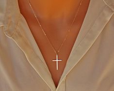 14K gold filled elegant Cross pendant hangs from a 14K gold filled chain. Also available in Sterling Silver. Description: -14K gold filled Cross -14K gold filled chain and components All materials used are made in USA, solid gold filled and not plated.