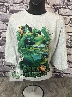 Ferxxo Tour Shirt 💚 This is a sublimation shirt, high quality ink transferred to t-shirt so there is a no feel design. The sublimation design is meant to look vintage and slightly faded. Soft and comfy t-shirts are high quality unisex shirts. The unisex sizes are retail fit and can be a little bit relaxed.  If you have a special request, please message me prior to purchasing.  Your shirt will be ready to ship within 7-14 days -- Care Instructions -- * Turn Inside Out * Wash In Cold/Warm Water * Use Mild Detergents * Tumble Dry Low Heat  **Please Make sure you have the correct address prior to purchasing** (Not held accountable for any shipping delays made by carrier) We also accept custom orders! **DUE TO VARIATIONS ON COMPUTER MONITORS CONFIGURATION, COLORS MAY VARY SLIGHTLY FROM PICTURE Pop Culture Shirt With Sublimation Print For Streetwear, Grunge Tops With Sublimation Print For Fan Merchandise, Grunge Custom Print Tops For Fan Merchandise, Grunge Tops With Custom Fan Merchandise Print, Grunge Tops With Custom Print For Fans, Pop Culture Sublimation Print Top For Streetwear, Band Merch Shirt With Sublimation Print For Streetwear, Hip Hop Tops With Sublimation Print For Fan Merchandise, Hip Hop Tops With Sublimation Print For Fans