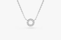 Diamond Circle Necklace / 14k Gold Mini Diamond Circle / Open Circle Necklace / Layering Diamond Necklace / Bridesmaid Gift / Gift for Her Features * Made to Order. * Gold KT: 14K * Choice of Gold Color: Rose Gold, Yellow Gold, White Gold * Height & Width: 7MM x 7MM * Round Diamond: 10 pcs 1.25MM * Total CTW: 0.10ctw * Diamond Color-Clarity: G Color Si Clarity * Setting Type: Prong * Ready to Ship in 7-10 Business Days ▶ Want to find out more? Check out my shop http://etsy.me/2lUcVnH ▶ Want Layering Diamond Necklaces, Diamond Circle Necklace, Open Circle Necklace, Special Necklace, Necklace Layering, Circle Diamond, Gold Diamond Necklace, Everyday Necklace, Circle Necklace