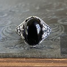 Filigree Ring - Black Onyx Stone in Silver 14x10mm | Ragtrader Vintage Victorian Black Sterling Silver Rings, Victorian Style Black Sterling Silver Rings, Black Cabochon Victorian Jewelry, Antique Black Oval Cabochon Jewelry, Black Oval Gothic Jewelry, Victorian Black Cabochon Jewelry, Classic Adjustable Black Enamel Rings, Gothic Black Oval Jewelry, Black Cabochon Signet Ring For Formal Occasions