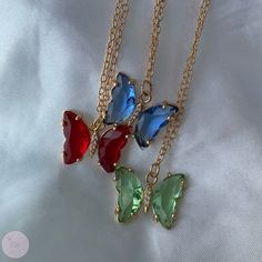 Colourful crystal butterfly necklace ✽ Each piece assembled by hand ✽ Available in 3 different colours!     blue*red*green ✽ If bought as gift, leave a message for special packaging at 'message seller' section when you checkout with name of person gift is for  Jewellery care: ✽ Advised to keep away from harsh chemicals    ✽ Avoid contact with moisture and fragrances  ✽ Remove before exercise, shower, sleeping etc Materials: ✽ Chain: Real 18k gold- plated ✽ Crystal butterfly pendant: Glass cubic zirconia, brass open back  Size: ✽ Necklace length: available in 16'', 18'', 20'' (see photo for reference) ✽ Butterfly: 15.5x20x4mm Feel free to message with any queries you may have or send a DM to our Instagram page - @riabyglo ❤️ Love, RIA Red Butterfly Necklace, Elegant Multicolor Butterfly Necklace As A Gift, Butterfly Shaped Necklace For Valentine's Day Gift, Elegant Multicolor Butterfly Necklace As Gift, Elegant Multicolor Butterfly Necklace Gift, Crystal Butterfly Charm Necklace, Butterfly Charm Necklace For Birthday, Red Butterfly-shaped Jewelry Gift, Red Butterfly Jewelry For Gift