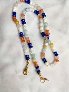 This beautiful rainbow gemstone necklace makes a perfect gift! Each bead is hand knotted onto silk thread, which gives the necklace a lovely drape. Necklace is 19 inches long, hand knotted with white silk string and has gold filled findings. This is a stunning necklace that completes any outfit. This necklace is a perfect gift!   GEMSTONES INCLUDED: Lapis Lazuli Mother of Pearl Shell Sunstone Morganite BENEFITS OF A HAND KNOTTED NECKLACE 1. A knotted necklace is safe and secure. If it should get Luxury Adjustable Rondelle Beaded Necklaces, Double Strand Gemstone Beads Gift, Rainbow Single Strand Beaded Necklace As Gift, Rainbow Gemstone Beaded Necklaces As A Gift, Rainbow Gemstone Beaded Necklaces For Gift, Rainbow Beaded Necklaces With Gemstone Beads As Gift, Rainbow Beaded Necklace With Gemstone Beads For Gift, Rainbow Crystal Necklaces With Round Beads Gift, Multicolor Single Strand Crystal Necklace For Healing