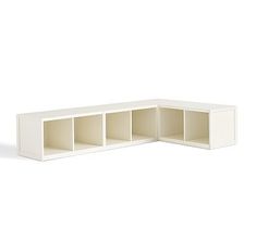 a white shelf with three compartments on each side