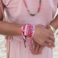 Friendship Never Goes Out of Style—Just Ask Taylor Swift! Good friends make life colorful, and what better way to celebrate that than with our Bali Friendship Bracelets? Inspired by Taylor Swift’s love for friendship bracelets, these beaded, hand-woven pieces are perfect for your bestie or your entire tribe. Stack them for a bolder look! Made by fair-trade female artisans in Bali, these bracelets feature an adjustable pull-tie closure and a brass Love Is Project tag. Buy one or bundle up for the Handwoven Beaded Bracelets With Round Beads, Colorful Beads Friendship Bracelets, Beaded Wrap Bracelet As Gift, Adjustable Handwoven Braided Bracelets, Colorful Adjustable Hand-strung Friendship Bracelets, Colorful Beaded Friendship Bracelets, Resizable Beaded Bracelets For Festivals, Adjustable Handwoven Bracelets, Resizable Multicolor Jewelry For Fashion