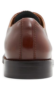 Handsome, polished and easy to wear, this wardrobe-staple leather oxford sports minimal detailing to give it maximum versatility across your formal wardrobe. Lace-up style Memory foam cushioning Leather upper/leather and textile lining/rubber sole Imported Timeless Brown Oxfords For Business Casual, Leather Cognac Oxfords With Brogue Detailing, Leather Oxfords With Brogue Detailing In Cognac, Classic Brown Oxfords For Business, Classic Brown Oxfords For Office, Classic Brown Business Oxfords, Cognac Dress Shoes With Brogue Detailing For Business Casual, Cognac Plain Toe Oxfords For Business Casual, Modern Brown Dress Shoes With Leather Footbed