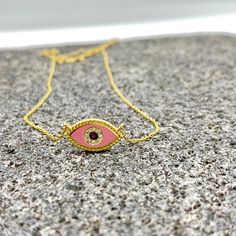 MELIGreece's lovely feminine chain necklace made of 18k yellow gold, a pink enamel eye with dotted surrounding, one central natural ruby weighting 0.01 cts. framed with natural diamonds weight in total : 0.03 cts. Dimensions of the eye charm : 1.7 cm. * 7.0 mm. / 0.67 - 0.27 inch. Length of the pink ruby diamond eye chain necklace : 39. 0 - 42. 0 cm. / 15.35 - 16.53 inch. A special gift proposal for this spring, accompanied by a stylish jewelry box and gift packaging. We combine it with MELIGreece's white diamond solid gold chain necklace https://www.etsy.com/listing/884490334/white-diamond-18k-yellow-or-rose-gold?click_key=d13d6ae24831f16551c74c1876b4d6af3387a9b5%3A884490334&click_sum=ceb56877&ref=shop_home_active_6&frs=1&sts=1. Important note: the enamel we use in our jewelry is of excel Handmade Yellow Gold Enamel Necklaces, Handmade Yellow Gold Enamel Necklace, Handmade 14k Gold Pink Jewelry, Handmade Pink 14k Gold Jewelry, Pink Gold Plated Round Necklace, Yellow Gold Enamel Jewelry With Adjustable Chain, Pink Necklace With Adjustable Chain As A Gift, Evil Eye Enamel Jewelry As A Gift, Evil Eye Enamel Jewelry Gift