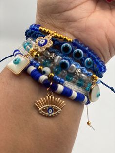 Arm candy anyone? Yes, this has an assortment of evil eyes that she can wear stackable or one at a time. Some will be threaded, some have faceted beads, some have Heishi beads, and some wooden beads. Combination looks great together, but can be sold individually. Great to wear for protection. Bohemian Blue Braided Bracelet With Evil Eye, Trendy Evil Eye Beaded Bracelets For Festivals, Bohemian Evil Eye Beaded Bracelets For Jewelry Making, Bohemian Beaded Evil Eye Bracelets For Jewelry Making, Bohemian Beaded Bracelets For Jewelry Making With Evil Eye, Trendy Evil Eye Bracelet For Festivals, Energy Stones Crystal Healing, Boho Beads, Evil Eyes