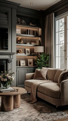 a living room with a couch, coffee table and bookshelf in the background